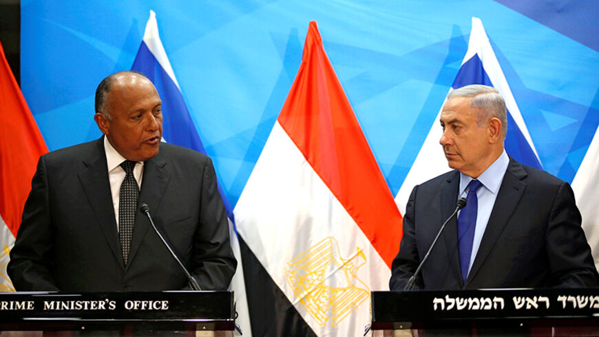 Israeli Prime Minister Benjamin Netanyahu (R) meets Egypt's Foreign Minister Sameh Shoukry in Jerusalem July 10, 2016 REUTERS/Ronen Zvulun - RTSH5M1