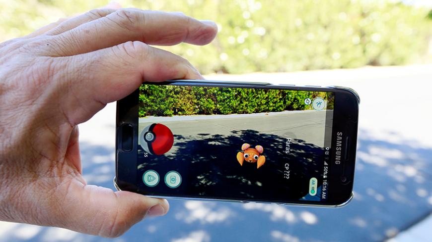 The augmented reality mobile game "Pokemon Go" by Nintendo is shown on a smartphone screen in this photo illustration taken in Palm Springs, California U.S. July 11, 2016.  REUTERS/Sam Mircovich/Illustration - RTSHFZ8