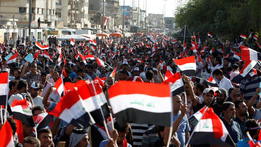Supporters of Iraqi Shi'ite cleric Moqtada al-Sadr shout slogans during a protest against corruption at Tahrir Square in Baghdad, July 15, 2016.  REUTERS/Khalid al Mousily - RTSI24U