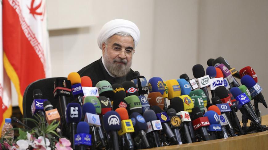 Iranian President-elect Hassan Rouhani speaks with the media during a news conference in Tehran June 17, 2013. REUTERS/Fars News/Majid Hagdost  (IRAN - Tags: POLITICS PROFILE) ATTENTION EDITORS - THIS IMAGE WAS PROVIDED BY A THIRD PARTY. FOR  EDITORIAL USE ONLY. NOT FOR SALE FOR MARKETING OR ADVERTISING CAMPAIGNS. THIS PICTURE IS DISTRIBUTED EXACTLY AS RECEIVED BY REUTERS, AS A SERVICE TO CLIENTS - RTX10QWN