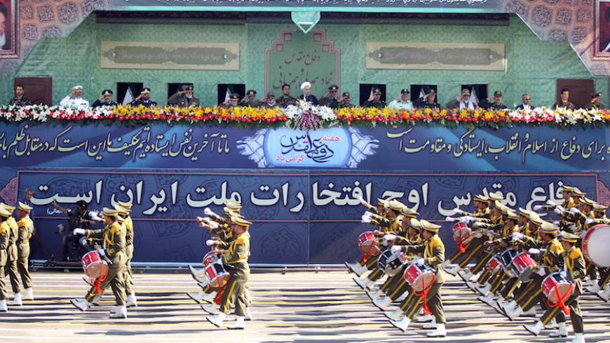 Members of the Iranian Army march past President Hassan Rouhani (C top) and military commanders during a parade marking the anniversary of the Iran-Iraq war (1980-88), in Tehran September 22, 2015. REUTERS/Raheb Homavandi/TIMA ATTENTION EDITORS - THIS PICTURE WAS PROVIDED BY A THIRD PARTY. REUTERS IS UNABLE TO INDEPENDENTLY VERIFY THE AUTHENTICITY, CONTENT, LOCATION OR DATE OF THIS IMAGE. FOR EDITORIAL USE ONLY. NOT FOR SALE FOR MARKETING OR ADVERTISING CAMPAIGNS. NO THIRD PARTY SALES. NOT FOR USE BY REUTER