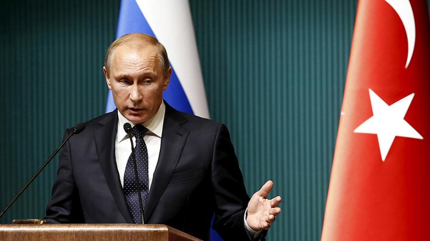 Russian President Vladimir Putin attends a news conference at the Presidential Palace in Ankara, Turkey in this December 1, 2014 file photo. Putin signed a decree imposing economic sanctions against Turkey on Saturday, four days after Turkey shot down a Russian warplane near the Syrian-Turkish border. REUTERS/Umit Bektas/Files - RTX1W9MO