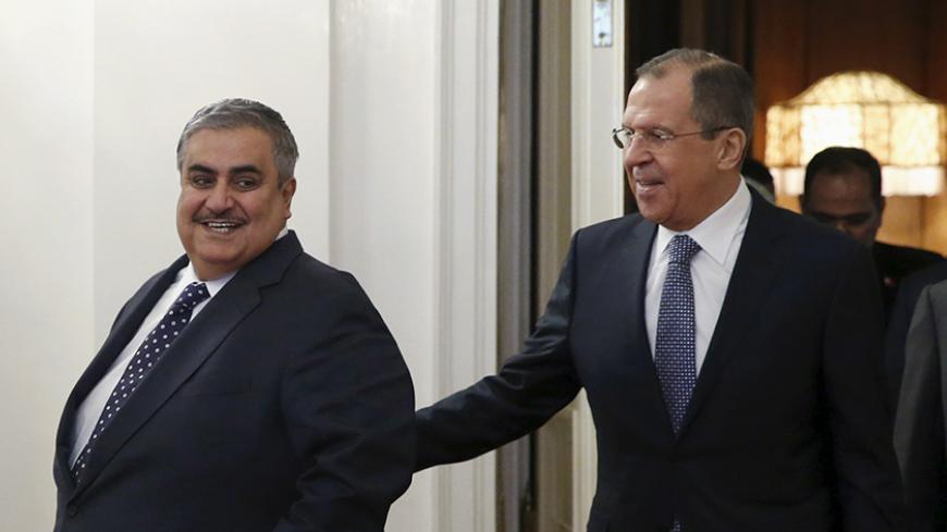 Russian Foreign Minister Sergei Lavrov (R) and his counterpart from Bahrain Khalid bin Ahmed Al Khalifa enter a hall during a meeting in Moscow, Russia, December 16, 2015. REUTERS/Maxim Shemetov  - RTX1YW9C