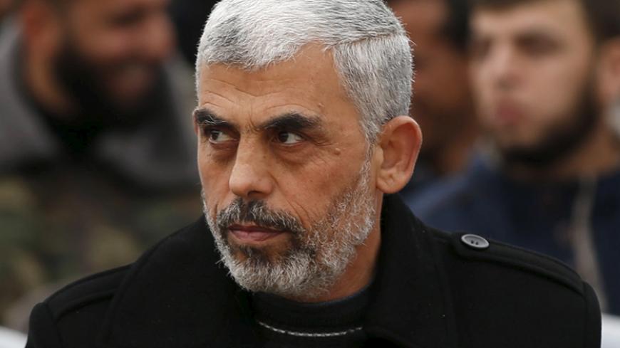 Hamas leader Yehia Sinwar attends a rally in Khan Younis in the southern Gaza Strip January 7, 2016. The rally, organized by Hamas movement, was held to honor the families of dead Hamas militants, who Hamas's armed wing said participated in imprisoning Israeli soldier Gilad Shalit, organizers said. Shalt was abducted by militants in a cross-border raid in 2006, and was released in exchange for more than 1,000 Palestinians held in Israeli jails. REUTERS/Mohammed Salem  - RTX21FPI