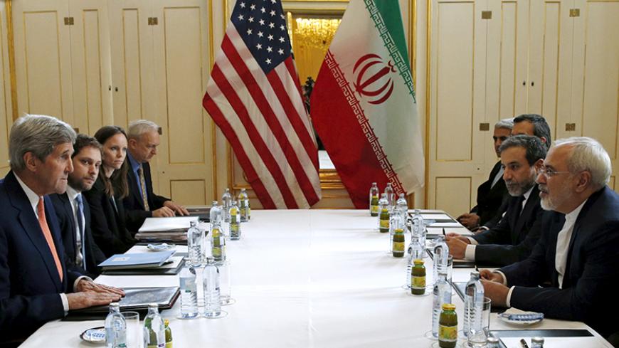 U.S. Secretary of State John Kerry (L) meets with Iranian Foreign Minister Mohammad Javad Zarif on what is expected to be "implementation day," the day the International Atomic Energy Agency (IAEA) verifies that Iran has met all conditions under the nuclear deal, in Vienna January 16, 2016.  REUTERS/Kevin Lamarque      TPX IMAGES OF THE DAY      - RTX22N89