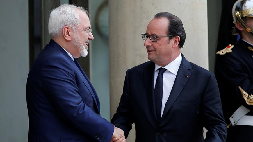 French President Francois Hollande (R) greets Iran's Foreign Minister Mohammad Javad Zarif before a meeting at the Elysee Palace in Paris, France, June 22, 2016. REUTERS/Stephane Mahe - RTX2HL6X