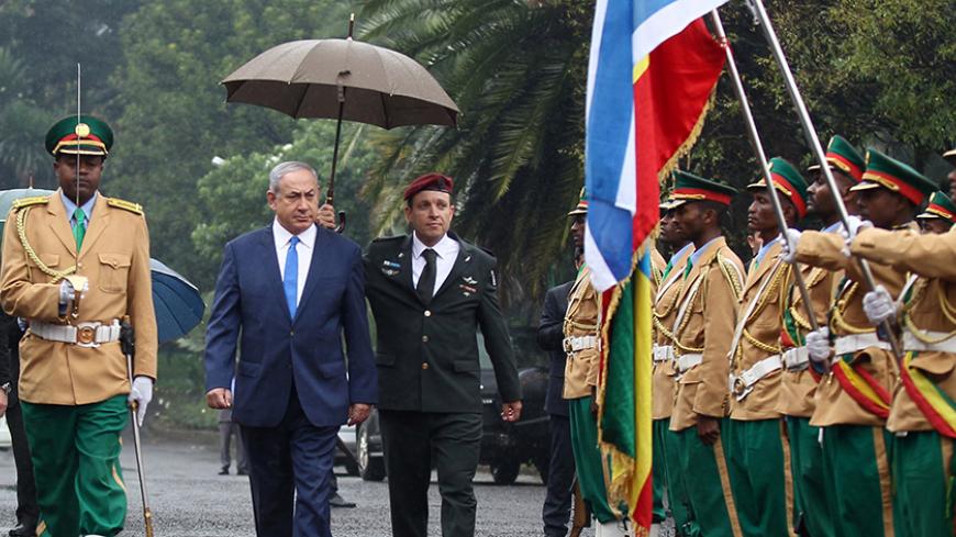 Israeli Prime Minister Benjamin Netanyahu inspects a guard of honor at the National Palace during his State visit to Addis Ababa, Ethiopia, July 7, 2016. REUTERS/Tiksa Negeri - RTX2K46G