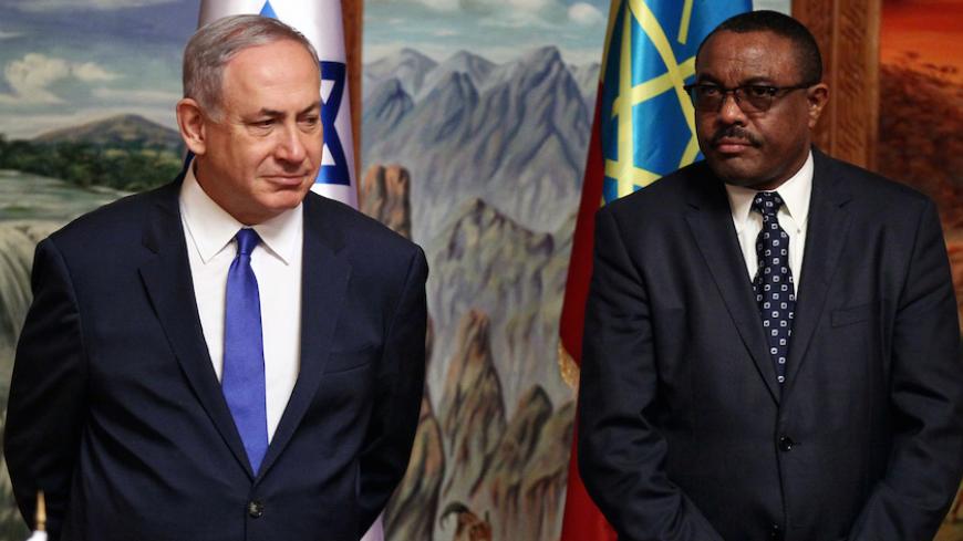 Israeli Prime Minister Benjamin Netanyahu (L) and his Ethiopian counterpart Hailemariam Desalegn arrive for a news conference at the National Palace during his State visit to Addis Ababa, Ethiopia, July 7, 2016. REUTERS/Tiksa Negeri? - RTX2K50Z