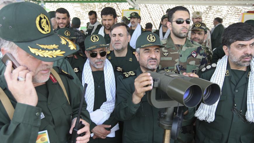 EDITORS' NOTE: Reuters and other foreign media are subject to Iranian restrictions on their ability to report, film or take pictures in Tehran. 

Revolutionary Guards commander Mohammad Ali Jafari (3rd R) monitors an area as he attends a war game in the Hormuz area of southern Iran April 24, 2010. REUTERS/Mehdi Marizad/Fars News (IRAN - Tags: MILITARY) QUALITY FROM SOURCE. FOR EDITORIAL USE ONLY. NOT FOR SALE FOR MARKETING OR ADVERTISING CAMPAIGNS - RTXS3O9