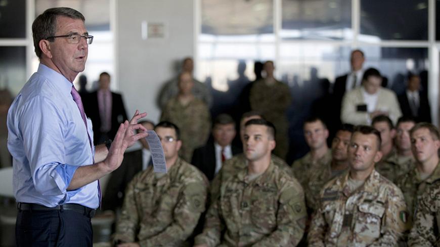 IRBIL, IRAQ - JULY 24: U.S. Defense Secretary Ash Carter talks to multinational troops at the Irbil International Airport on July 24, 2015 in Irbil, Iraq.  Carter is wrapping up weeklong tour of the Middle East focused on reassuring allies about Iran and assessing progress in the coalition campaign against the Islamic State group in Syria and Iraq. (Photo by Carolyn Kaster - Pool/Getty Images)