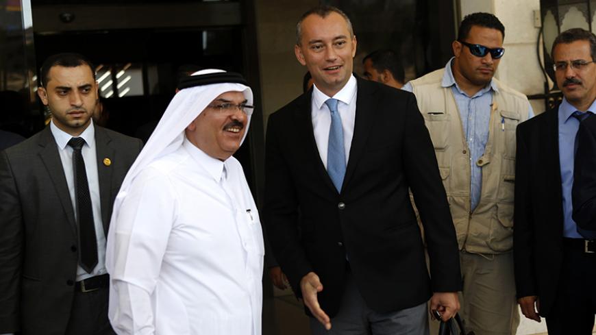 United Nations Middle East peace envoy Nickolay Mladenov (R) and Qatari Mohammed al-Emadi (2nd L), of the National Committee for the Reconstruction of Gaza, visit a project financed by Qatari company Al-Emadi on September 17, 2015 in Gaza City. AFP PHOTO / MOHAMMED ABED        (Photo credit should read MOHAMMED ABED/AFP/Getty Images)