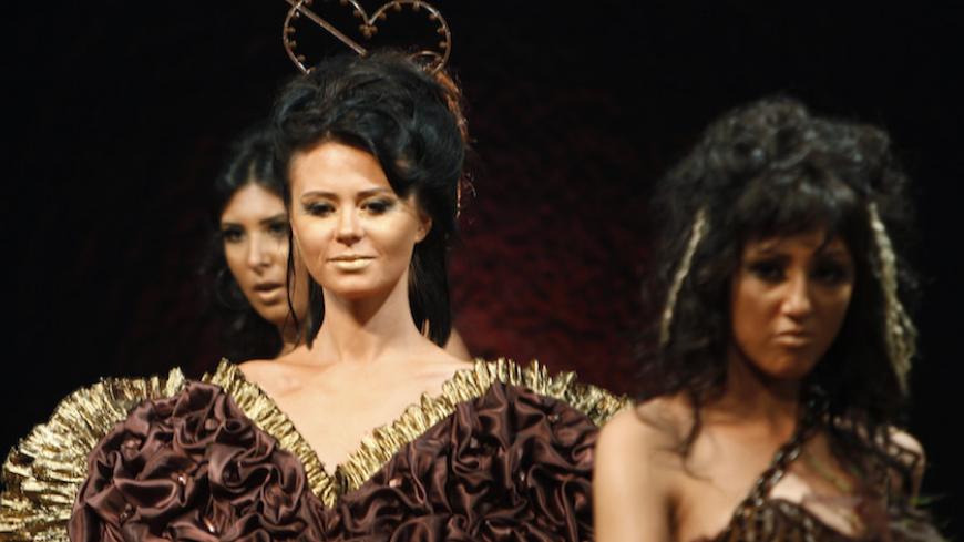 Models present creations which incorporate chocolate during a fashion show at the Chocolate Festival in Cairo April 1, 2010. 
REUTERS/Tarek Mostafa  (EGYPT - Tags: FASHION FOOD) - RTR2CCD8