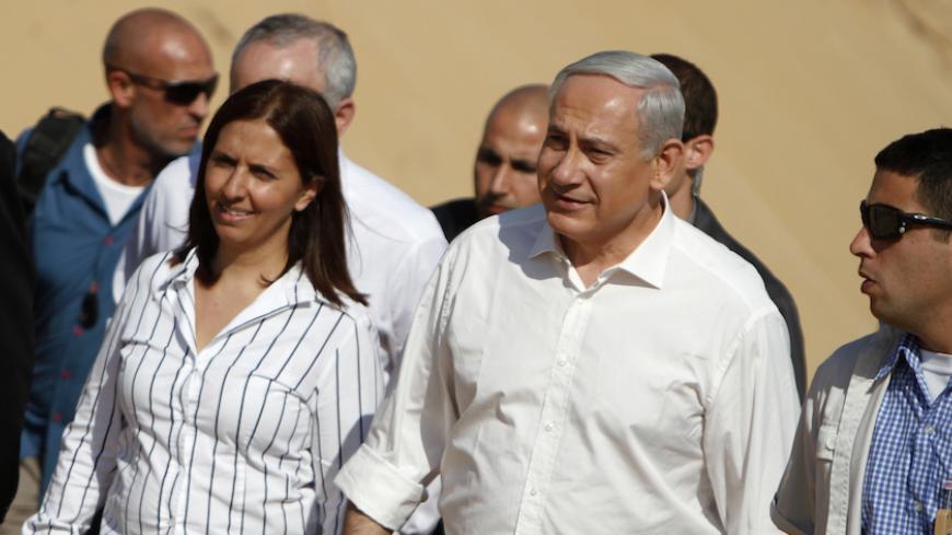 Israel's Prime Minister Benjamin Netanyahu (2nd R) and Knesset member Gila Gamliel (L) tour a planned site for the construction of a hospital during a corner stone laying ceremony in the port city of Ashdod November 8, 2012. REUTERS/Amir Cohen (ISRAEL - Tags: POLITICS HEALTH) - RTR3A5T8