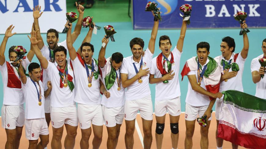 Iran's gold medal winning volleyball team pose during the medal ceremony after their men's gold medal volleyball match against Japan at Songnim Gymnasium during the 17th Asian Games in Incheon October 3, 2014. REUTERS/Olivia Harris (SOUTH KOREA  - Tags: SPORT VOLLEYBALL)   - RTR48THJ
