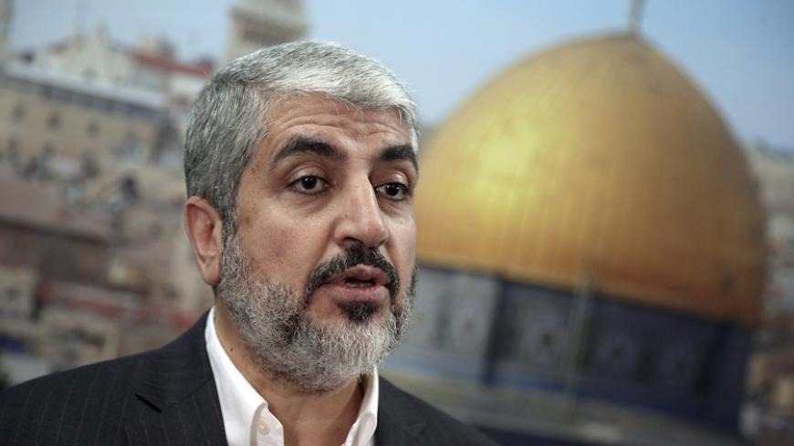 Hamas leader Khaled Meshaal speaks during an interview with Reuters in Doha October 16, 2014. Meshaal on Thursday called on Muslims to defend the al-Aqsa mosque compound in Jerusalem, saying Israel was trying to seize the site, revered in Islam and Judaism and focus of a Palestinian uprising in 2000.      REUTERS/Fadi Al-Assaad (QATAR - Tags: POLITICS RELIGION) - RTR4AH1S