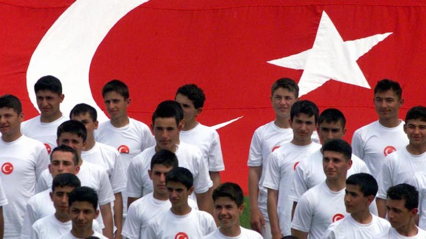 Students of Turkish military high school of Kuleli stand before a Turkish flag during their performance in Inonu Stadium May 19, 2001, to celebrate Youth and Sports Day. Turkey is celebrating Youth and Sports Day with parades by students and military throughout the country.

FS/WS - RTRIHY6