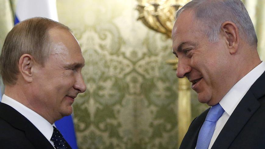 Russian President Vladimir Putin (L) welcomes Israeli Prime Minister Benjamin Netanyahu during a meeting at the Kremlin in Moscow, Russia June 7, 2016. REUTERS/Maxim Shipenkov/Pool - RTSGEFC