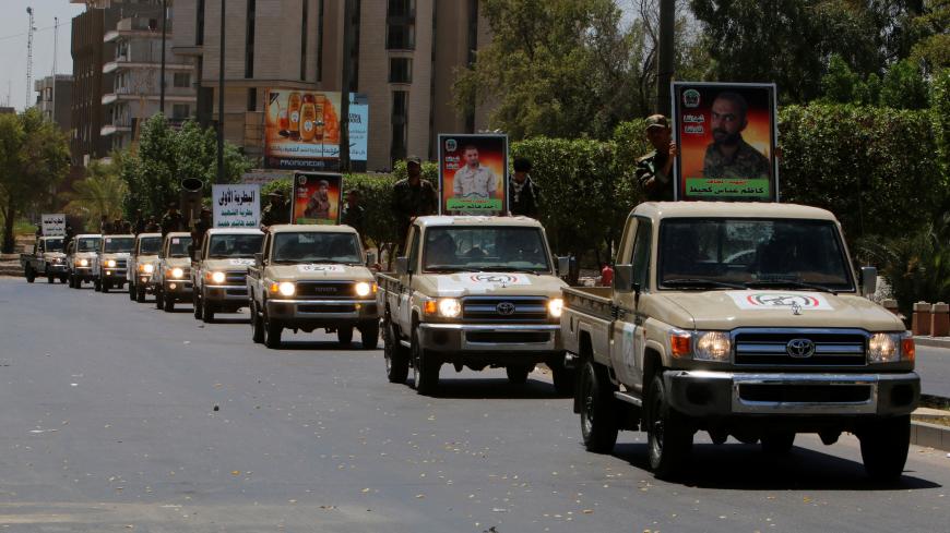 Vehicles of the Hashid Shaabi (Popular Mobilization) take part in a military parade in the streets of Baghdad, Iraq July 12, 2016. REUTERS/Khalid al Mousily - RTSHJ8K