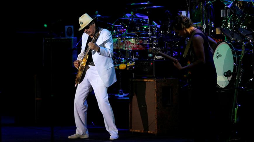 Musician Carlos Santana (L) performs during a concert at the Starlite Festival in Marbella, southern Spain, July 24, 2016. REUTERS/Jon Nazca - RTSJFY7