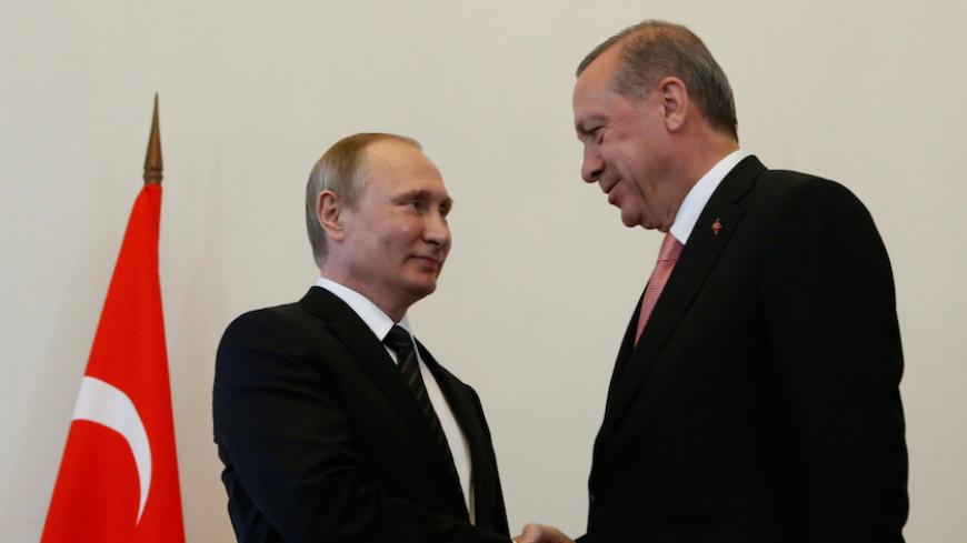 Russian President Vladimir Putin shakes hands with Turkish President Tayyip Erdogan during their meeting in St. Petersburg, Russia, August 9, 2016.  REUTERS/Sergei Karpukhin  TPX IMAGES OF THE DAY      - RTSM27W