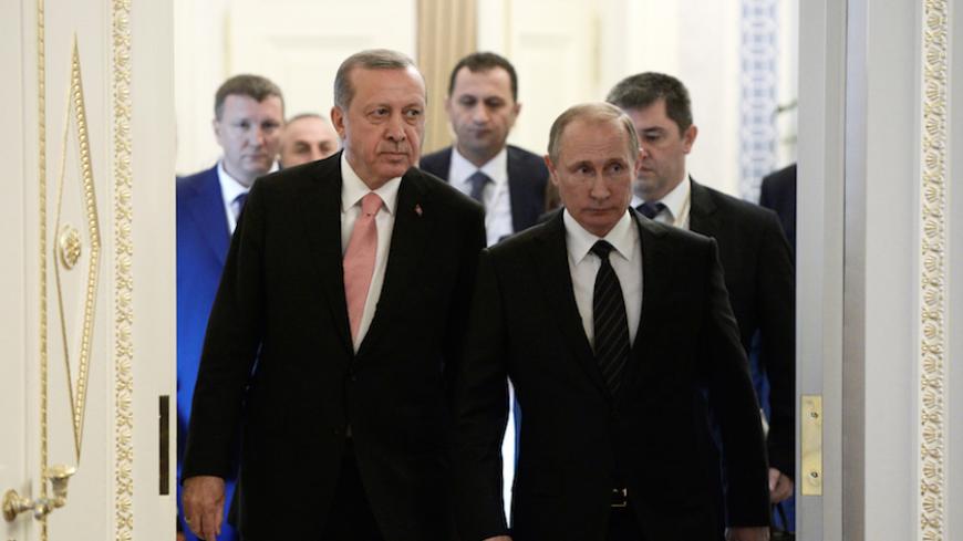 Russian President Vladimir Putin (R) and Turkish President Tayyip Erdogan enter a hall during their meeting in St. Petersburg, Russia, August 9, 2016. Sputnik/Kremlin/Alexei Nikolsky/via REUTERS     ATTENTION EDITORS - THIS IMAGE WAS PROVIDED BY A THIRD PARTY. EDITORIAL USE ONLY. - RTSM2XI
