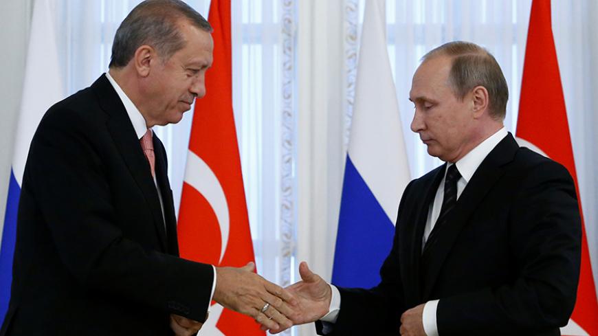 Russian President Vladimir Putin shakes hands with Turkish President Tayyip Erdogan during a news conference following their meeting in St. Petersburg, Russia, August 9, 2016.  REUTERS/Sergei Karpukhin     TPX IMAGES OF THE DAY      - RTSM4CK