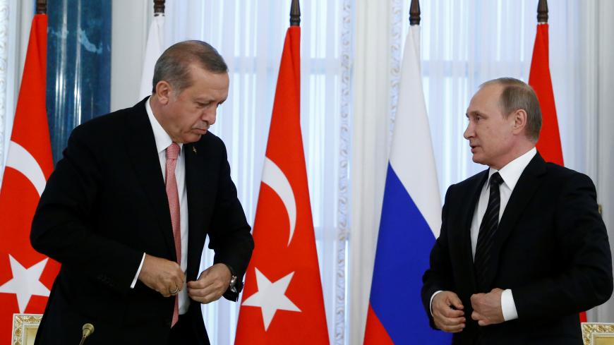 Russian President Vladimir Putin and Turkish President Tayyip Erdogan attend a news conference following their meeting in St. Petersburg, Russia, August 9, 2016.  REUTERS/Sergei Karpukhin - RTSM4JY