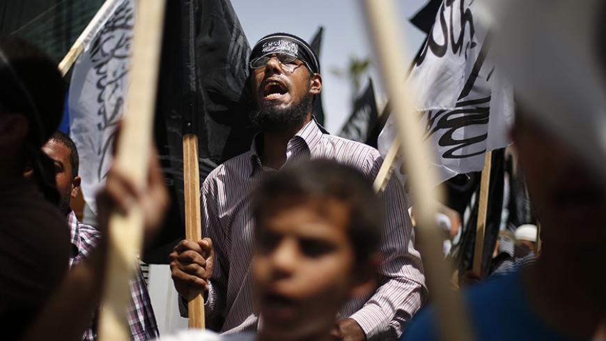 Palestinian supporters of Hizb ut-Tahrir take part in a rally calling for Khilafah, or Islamic rule, in Gaza City June 5, 2013. REUTERS/Mohammed Salem (GAZA - Tags: POLITICS CIVIL UNREST) - RTX10CH3