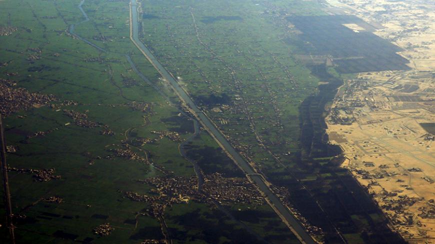 An aerial view of farmland on the Nile River Delta, Egypt, is pictured through a plane window February 15, 2016. Egypt said on Sunday it would pay its local farmers a fixed price of 420 Egyptian pounds ($53.64) per ardeb (150 kg) of wheat in the new local procurement season starting in April, backtracking on reforms to its wheat farmer subsidy system. REUTERS/Amr Abdallah Dalsh - RTX272R4
