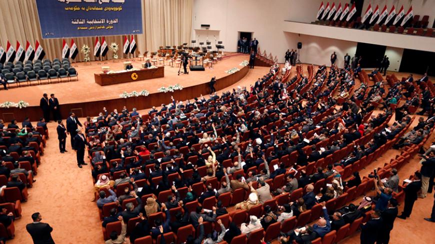 FILE PHOTO Members of the Iraqi parliament gather to vote on Iraq's new government at the parliament headquarters in Baghdad, September 8, 2014. REUTERS/Thaier Al-Sudani/File Photo - RTX2N0L2