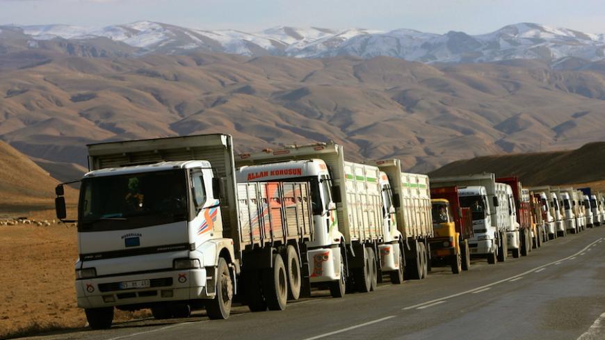 - PHOTO TAKEN 30NOV05 - Hundreds of trucks bringing in diesel from Iran line up on a road as they head to the eastern province of Van in Turkey November 30, 2005. [In the shadows of mountains bordering Iraq and Iran, Turkey's Hakkari province may one day be an outpost of the European Union. But for now, it feels cut off from the world. Picture taken November 30, 2005.] - RTXO1TK