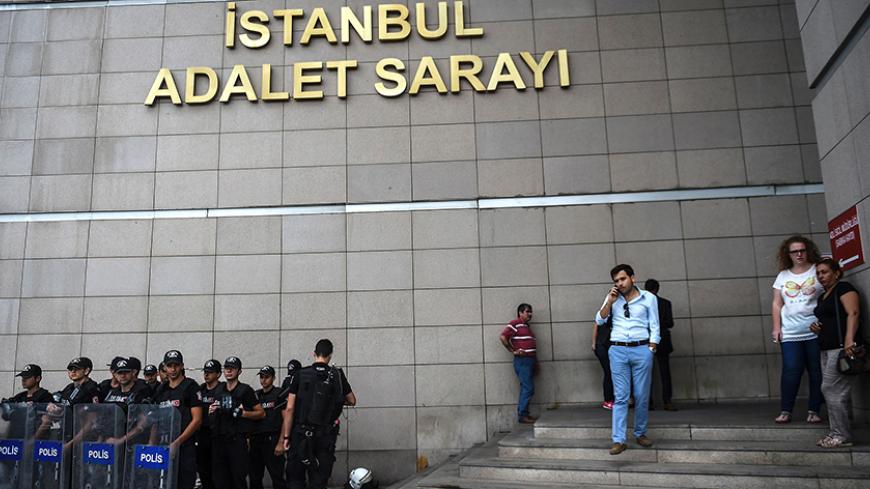 Turkish police stands guard in front of the Istanbul courthouse on July 20, 2016 following the military coup attempt of July 15.
Turkish President Recep Tayyip Erdogan was today to chair a crunch security meeting in Ankara for the first time since the failed coup, with tens of thousands either detained or sacked from their jobs in a widening purge. / AFP / BULENT KILIC        (Photo credit should read BULENT KILIC/AFP/Getty Images)