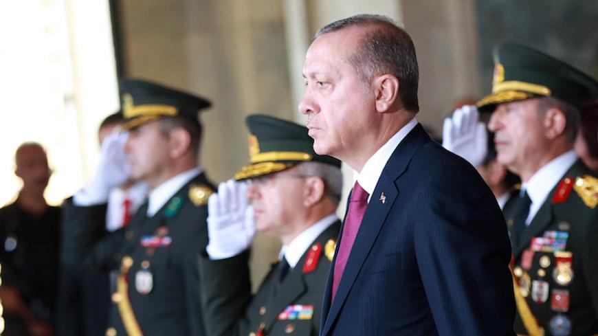 Turkish President Recep Tayyip Erdogan (C) attends a ceremony at the Ataturk mausoleum to mark the 94th anniversary of Turkeys Victory Day in Ankara on August 30, 2016. / AFP / ADEM ALTAN        (Photo credit should read ADEM ALTAN/AFP/Getty Images)