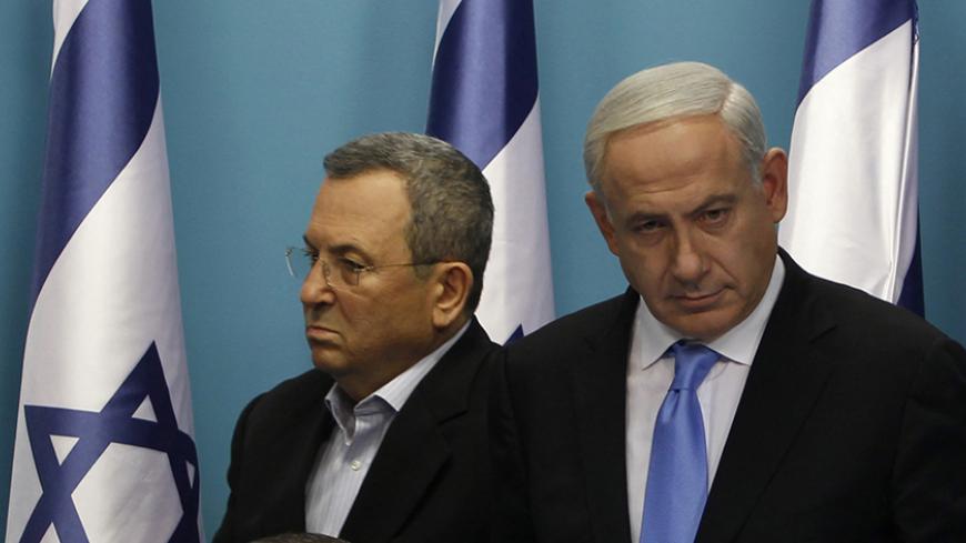 Israel's Prime Minister Benjamin Netanyahu (R) takes a seat next to Foreign Minister Avigdor Lieberman (bottom) as Defence Minister Ehud Barak walks to deliver a statement in Jerusalem November 21, 2012. Netanyahu hinted on Wednesday that if an Egyptian-brokered truce with Islamist militants in Gaza did not work Israel would consider "more severe military action" against the Palestinian territory. REUTERS/Baz Ratner (JERUSALEM - Tags: POLITICS CONFLICT) - RTR3APHV