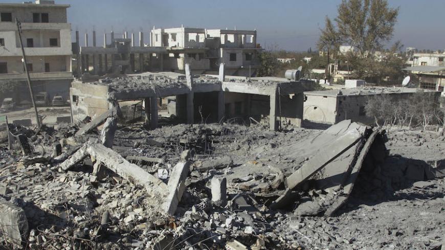 A view shows collapsed buildings after what activists said was a U.S.-led air strike on Harem city in Idlib countryside November 7, 2014. REUTERS/Ammar Abdullah (SYRIA - Tags: POLITICS CIVIL UNREST CONFLICT) - RTR4DB3M