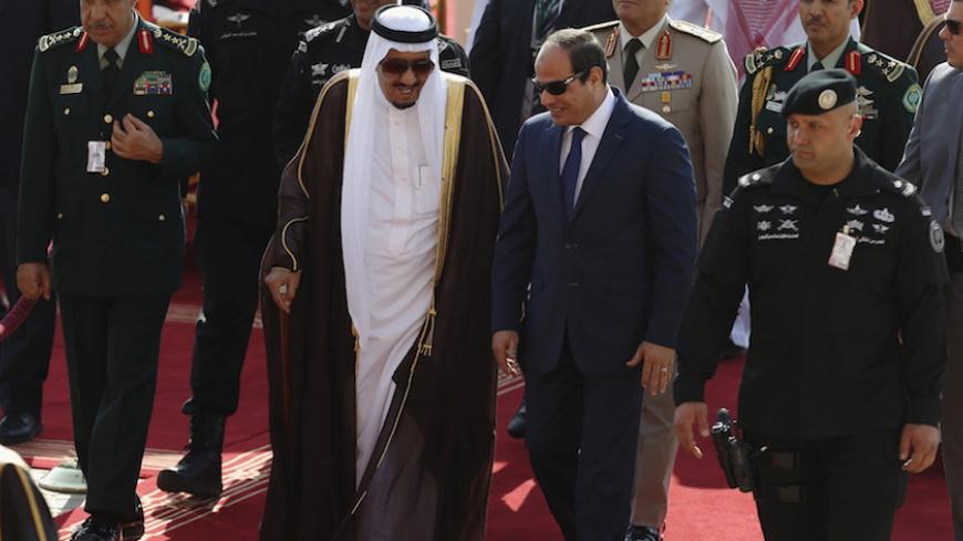 Saudi King Salman bin Abdulaziz (C-L) walks with Egypt's President Abdel Fattah al-Sisi during a welcoming ceremony upon al-Sisi's arrival to attend the Summit of South American-Arab Countries, in Riyadh November 10, 2015. REUTERS/Faisal Al Nasser TPX IMAGES OF THE DAY      - RTS6BGC