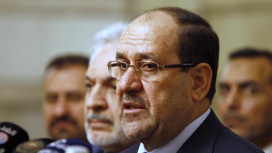 Iraq's then Vice President Nuri al-Maliki speaks during a news conference in Baghdad in this file photo taken November 29, 2014. The U.S. and Iran have formed an unlikely tacit alliance behind Iraq's prime minister as he challenges the ruling elite with plans for a non-political cabinet to fight corruption undermining the OPEC nation's economic and political stability. Local calls for Haider al-Abadi's removal -- including one by his predecessor as prime minister al-Maliki -- had been growing as he pursued 