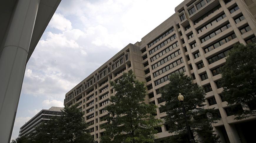 An exterior view of the International Monetary Fund (IMF) headquarters is seen in Washington July 1, 2015. Greece's last-minute overtures to international creditors for financial aid on Tuesday were not enough to save the country from becoming the first developed economy to default on a loan with the International Monetary Fund. REUTERS/Jonathan Ernst - RTX1IO51