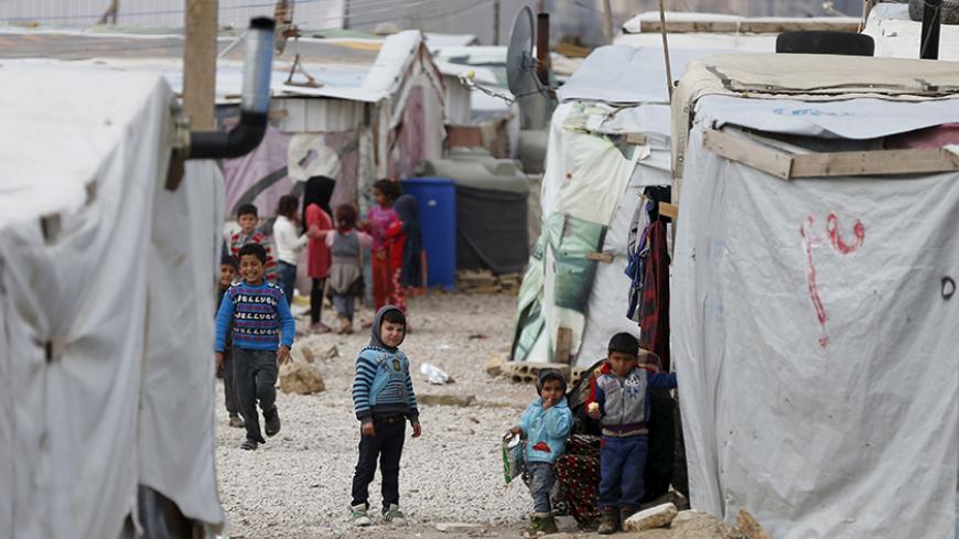 Syrian children are seen inside an informal settlement for Syrian refugees in Bar Elias, Bekaa valley, Lebanon, January 6, 2016. More than 1 million Syrians are enduring another winter as refugees in Lebanon. For some, it is their fifth in a row, displaced by a war that has driven 4.4 million Syrians into neighbouring states from where many are trying to reach Europe. REUTERS/ Jamal Saidi - RTX21K68