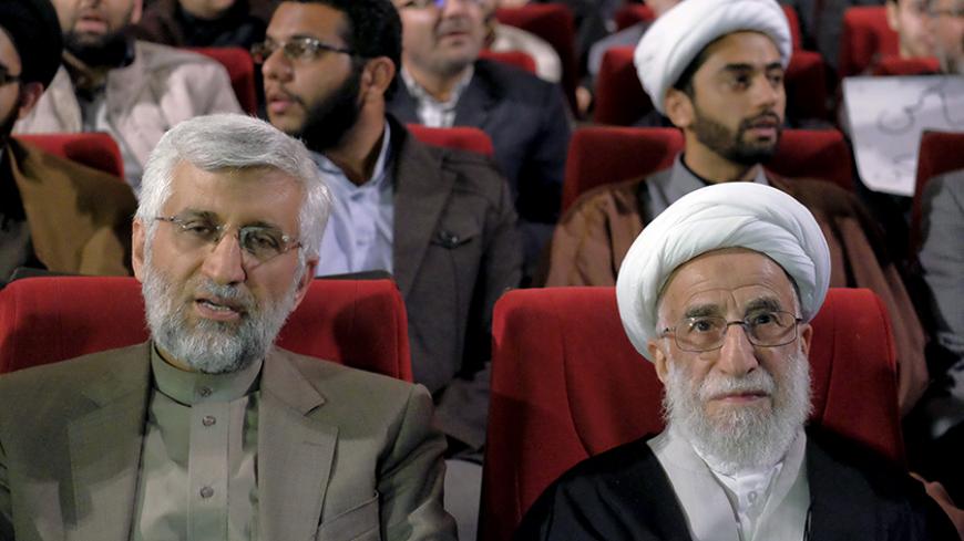 Ayatollah Ahmad Jannati (R), a candidate for the upcoming vote on the Assembly of Experts, and Iran's former chief negotiator Saeed Jalili attend a conservatives election campaign gathering in Tehran February 24, 2016. The campaign gathering was titled "No to UK Meddling". REUTERS/Raheb Homavandi/TIMA  ATTENTION EDITORS - THIS IMAGE WAS PROVIDED BY A THIRD PARTY. FOR EDITORIAL USE ONLY.   - RTX28EQJ