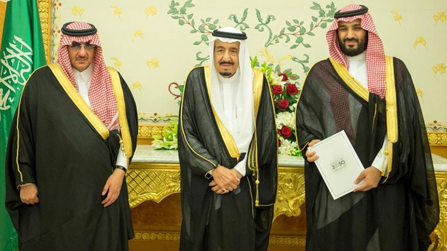 (L-R) Saudi Crown Prince Mohammed bin Nayef, Saudi King Salman, and Saudi Arabia's Deputy Crown Prince Mohammed bin Salman stand together as Saudi Arabia's cabinet agrees to implement a broad reform plan known as Vision 2030 in Riyadh, April 25, 2016. To match Insight SAUDI-PLAN/PRINCE  Saudi Press Agency/Handout/File Photo via REUTERS.    ATTENTION EDITORS - THIS IMAGE WAS PROVIDED BY A THIRD PARTY. EDITORIAL USE ONLY. NO RESALES. NO ARCHIVE.  - RTX2CU2M