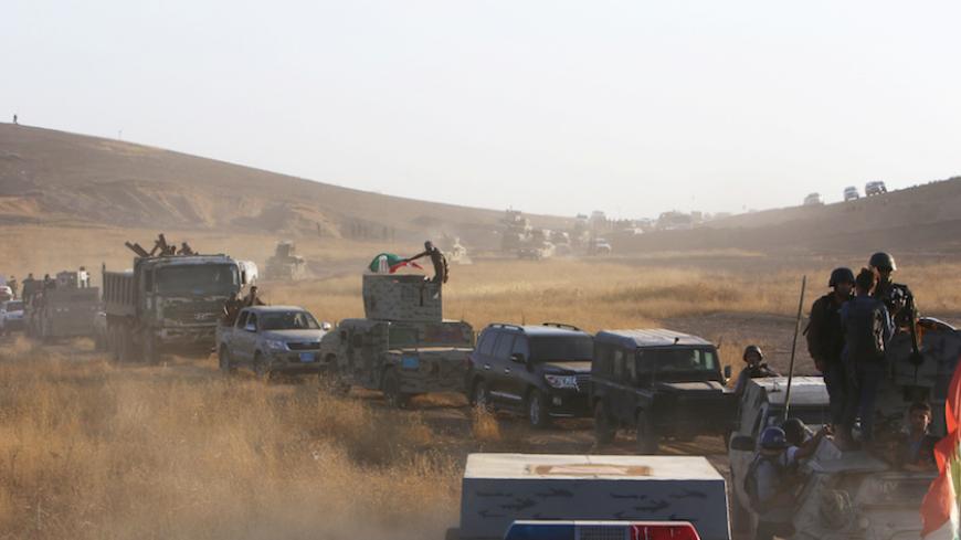 Military vehicles of the Kurdish Peshmerga forces are seen on the southeast of Mosul , Iraq, August 14, 2016. REUTERS/Azad Lashkari - RTX2KRSN