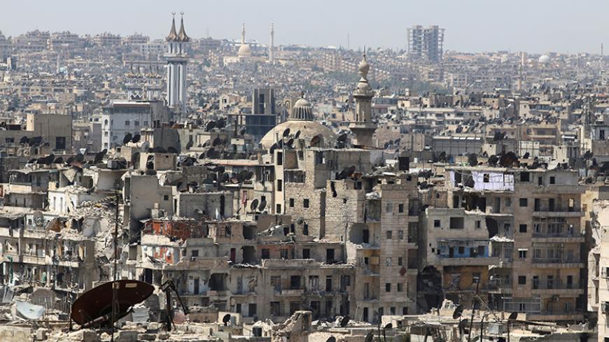A general view shows government-controlled areas of Aleppo as seen from rebel-held part of the city, Syria August 22, 2016. REUTERS/Abdalrhman Ismail - RTX2MKAQ