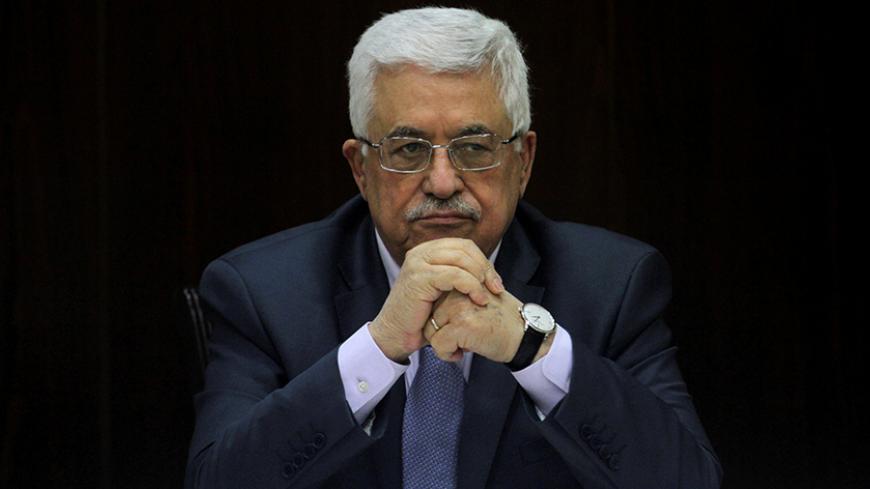 Palestinian President Mahmoud Abbas heads a Palestinian cabinet meeting in the West Bank city of Ramallah July 28, 2013. REUTERS/Issam Rimawi/Pool/File Photo - RTX2O7X6