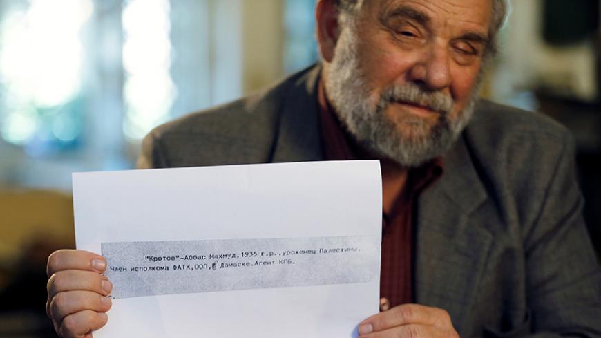 Gideon Remez, one of the Israeli researchers who said on Thursday that Soviet-era documents showed that Palestinian President Mahmoud Abbas worked in the 1980s for the KGB, the now-defunct Russian intelligence agency, holds up a page he received after some documents smuggled out of Russia by a former KGB archivist were released for public research two years ago, with a line in Russian reading, " "Krotov", which is the derived from the Russian word for "mole" and, "Abbas, Mahmoud, born 1935 in Palestine, mem