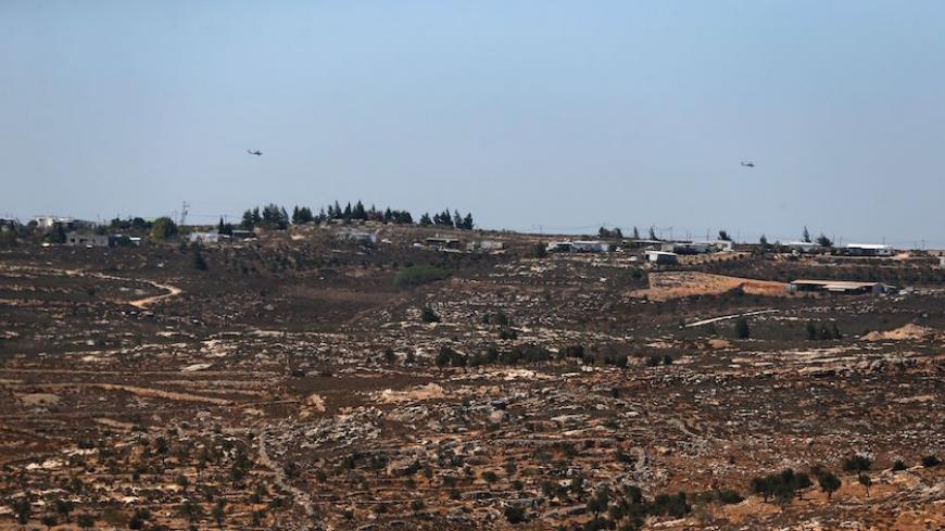 A picture taken from the West Bank Christian village of Taybeh on September 11, 2016, shows the wildcat Jewish settlement of Amona.
An Israeli court has ruled that the wildcat Jewish settlement of Amona, where live around 40 families in mainly caravan homes, is on Palestinian property and must be evacuated by December 25. Settlements such as Amona are called outposts -- those that Israel has not approved. Outpost residents hope such authorisation will one day be provided, as has occurred in other cases. Amo