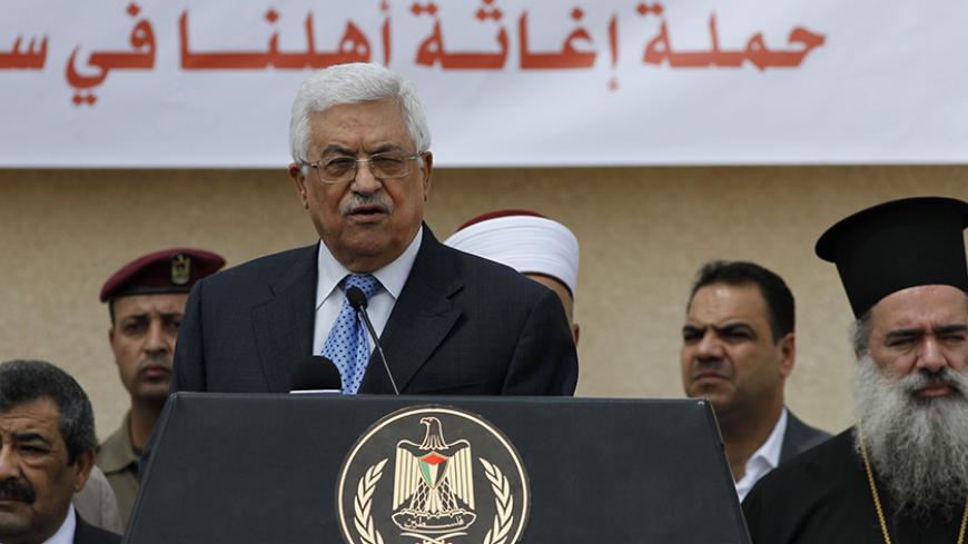 Palestinian President Mahmoud Abbas speaks to the media during a press event in the West Bank city of Ramallah August 5, 2012. An aid convoy left Ramallah on Sunday carrying food and medicine in a symbol of support for Palestinian refugees caught up in the crisis in Syria. Sixteen trucks drove through Abbas's presidential compound before leaving for Jordan bound for Damascus. REUTERS/Mohamad Torokman (WEST BANK - Tags: POLITICS CIVIL UNREST SOCIETY) - RTR366DZ