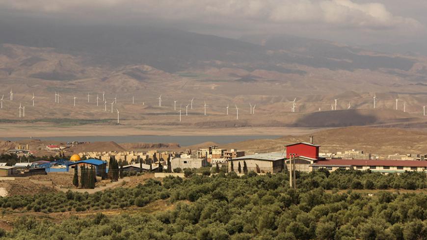 Wind turbines are seen in Manjil, in the province of Gilan, August 7, 2013. Picture taken August 7, 2013.       REUTERS/Michelle Moghtader (IRAN  - Tags: ENERGY)   - RTR4D5G6