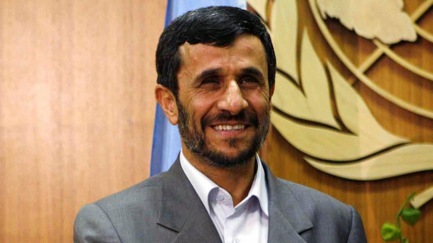 File Photo - Iranian President Mahmoud Ahmadinejad smiles as he meets with United Nations Secretary-General Ban Ki-moon at the United Nations in New York September 24, 2007. REUTERS/Eric Thayer/File Photo - RTSPNRZ