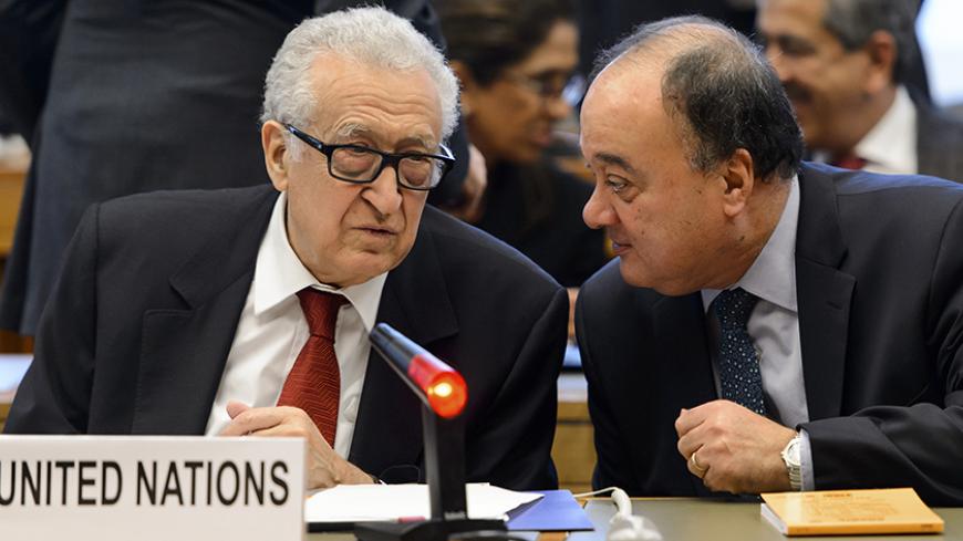 Lakhdar Brahimi (L), the U.N. envoy on Syria, speaks with his deputy Nasser Al-Kidwa before a meeting at the United Nations offices in Geneva December 20, 2013.  REUTERS/Fabrice Coffrini/Pool   (SWITZERLAND - Tags: POLITICS) - RTX16PNS